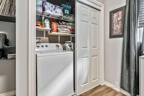 1957 High Country Drive Nw, High River, AB - Indoor Photo Showing Laundry Room