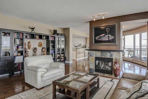 2401-1078 6 Avenue Sw, Calgary, AB - Indoor Photo Showing Living Room With Fireplace