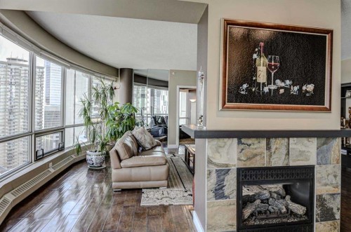 2401-1078 6 Avenue Sw, Calgary, AB - Indoor With Fireplace