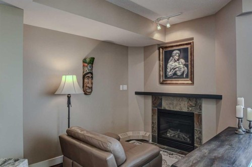 2401-1078 6 Avenue Sw, Calgary, AB - Indoor Photo Showing Living Room With Fireplace