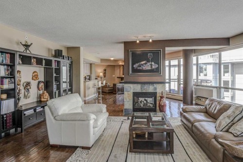 2401-1078 6 Avenue Sw, Calgary, AB - Indoor Photo Showing Living Room With Fireplace