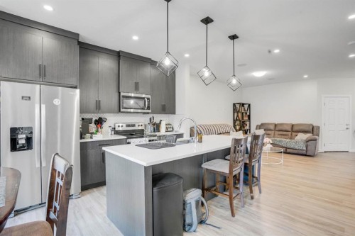 28 Midtown Close Sw, Airdrie, AB - Indoor Photo Showing Kitchen With Stainless Steel Kitchen With Upgraded Kitchen