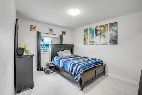 28 Midtown Close Sw, Airdrie, AB - Indoor Photo Showing Bedroom