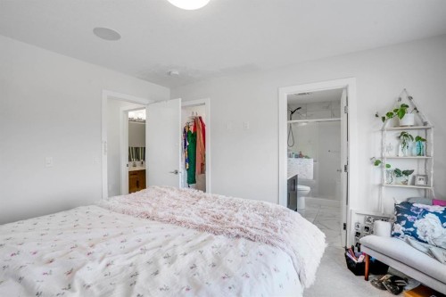 28 Midtown Close Sw, Airdrie, AB - Indoor Photo Showing Bedroom