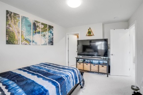28 Midtown Close Sw, Airdrie, AB - Indoor Photo Showing Bedroom
