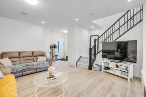 28 Midtown Close Sw, Airdrie, AB - Indoor Photo Showing Living Room