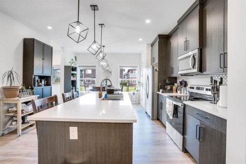 28 Midtown Close Sw, Airdrie, AB - Indoor Photo Showing Kitchen With Upgraded Kitchen