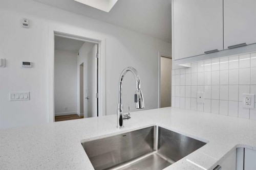 2313-8500 19 Avenue Se, Calgary, AB - Indoor Photo Showing Kitchen With Double Sink