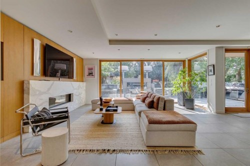 529 Sunderland Avenue Sw, Calgary, AB - Indoor Photo Showing Living Room With Fireplace