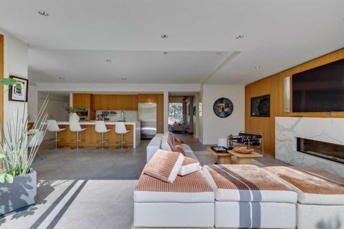 529 Sunderland Avenue Sw, Calgary, AB - Indoor Photo Showing Living Room With Fireplace