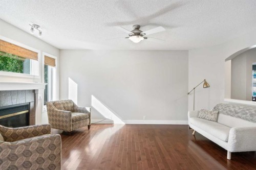 45 Mt Douglas Close Se, Calgary, AB - Indoor Photo Showing Living Room With Fireplace