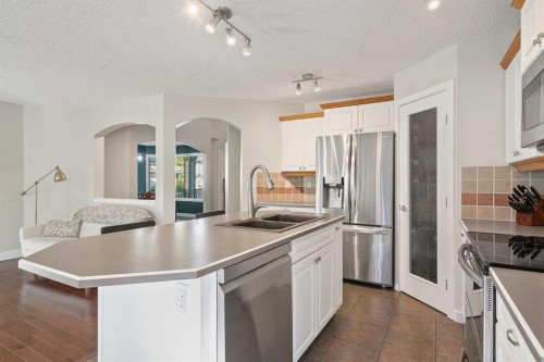 45 Mt Douglas Close Se, Calgary, AB - Indoor Photo Showing Kitchen With Double Sink