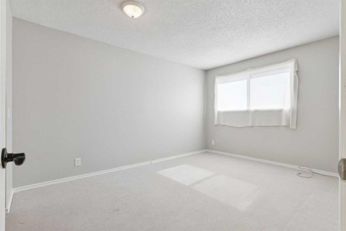 102-7416 Hunterview Drive Nw, Calgary, AB - Indoor Photo Showing Other Room