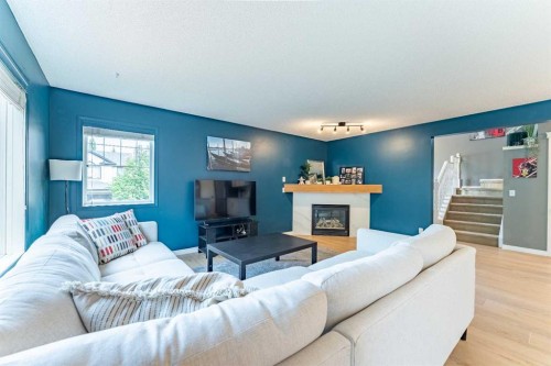 76 Cranfield Place Se, Calgary, AB - Indoor Photo Showing Living Room With Fireplace
