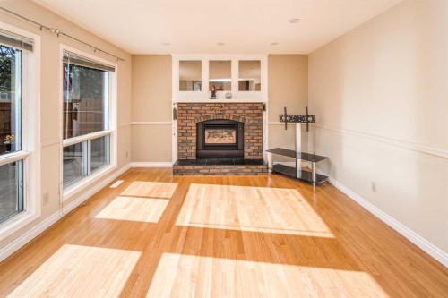 16 Sunhaven Way Se, Calgary, AB - Indoor Photo Showing Living Room With Fireplace