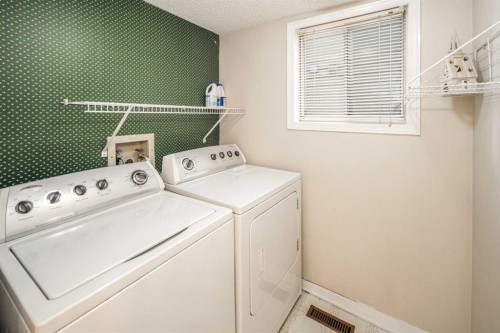 16 Sunhaven Way Se, Calgary, AB - Indoor Photo Showing Laundry Room
