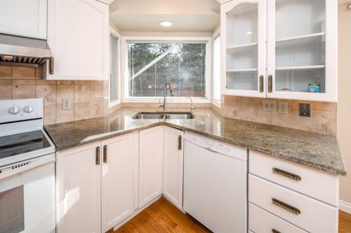 16 Sunhaven Way Se, Calgary, AB - Indoor Photo Showing Kitchen With Double Sink