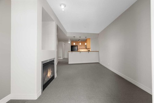1108-836 15 Avenue Sw, Calgary, AB - Indoor Photo Showing Other Room With Fireplace