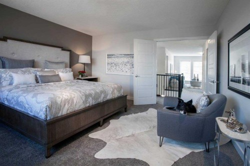 51 Sunrise Heath, Cochrane, AB - Indoor Photo Showing Bedroom