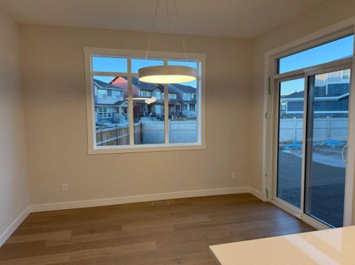 51 Sunrise Heath, Cochrane, AB - Indoor Photo Showing Other Room