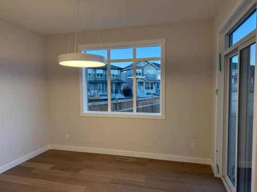 51 Sunrise Heath, Cochrane, AB - Indoor Photo Showing Other Room