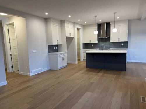 51 Sunrise Heath, Cochrane, AB - Indoor Photo Showing Kitchen