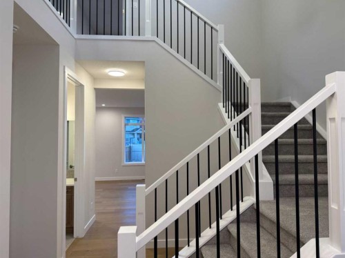 51 Sunrise Heath, Cochrane, AB - Indoor Photo Showing Other Room