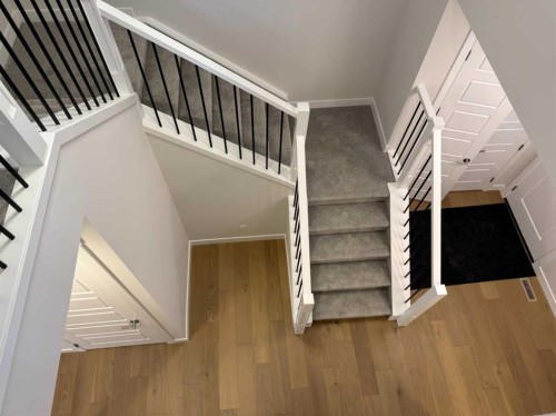 51 Sunrise Heath, Cochrane, AB - Indoor Photo Showing Other Room