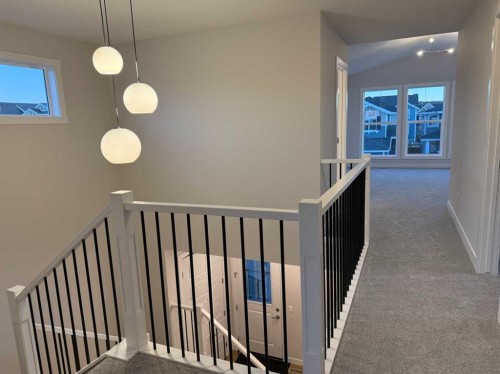 51 Sunrise Heath, Cochrane, AB - Indoor Photo Showing Other Room