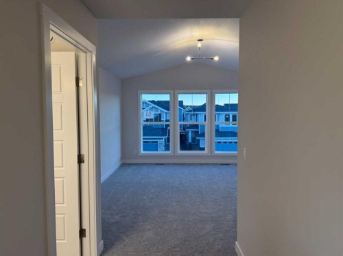 51 Sunrise Heath, Cochrane, AB - Indoor Photo Showing Other Room