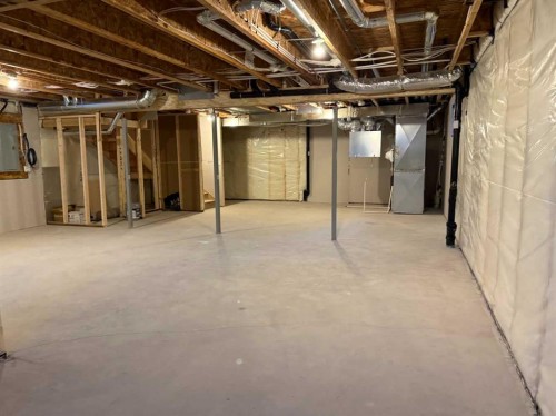 51 Sunrise Heath, Cochrane, AB - Indoor Photo Showing Basement