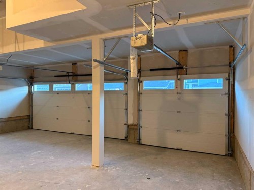 51 Sunrise Heath, Cochrane, AB - Indoor Photo Showing Garage