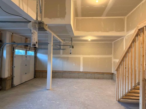 51 Sunrise Heath, Cochrane, AB - Indoor Photo Showing Garage