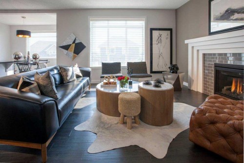 51 Sunrise Heath, Cochrane, AB - Indoor Photo Showing Living Room With Fireplace