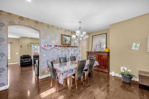 217 Taralake Manor Ne, Calgary, AB - Indoor Photo Showing Dining Room With Fireplace