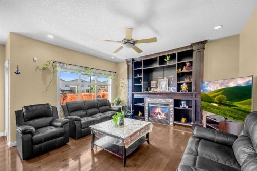 217 Taralake Manor Ne, Calgary, AB - Indoor Photo Showing Living Room With Fireplace