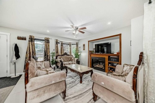 49 Taravista Way Ne, Calgary, AB - Indoor Photo Showing Living Room With Fireplace