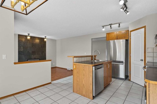 47 Mt Apex Crescent Se, Calgary, AB - Indoor Photo Showing Kitchen With Double Sink