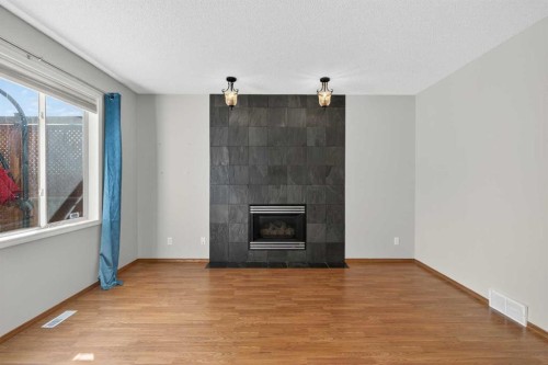 47 Mt Apex Crescent Se, Calgary, AB - Indoor Photo Showing Living Room With Fireplace