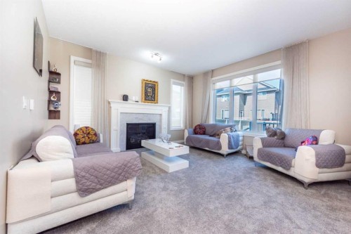 287 Baywater Way Sw, Airdrie, AB - Indoor Photo Showing Living Room With Fireplace
