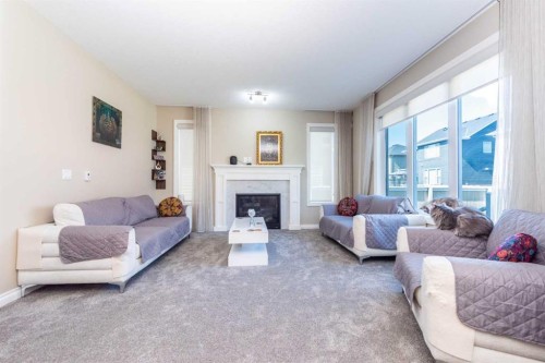 287 Baywater Way Sw, Airdrie, AB - Indoor Photo Showing Living Room With Fireplace