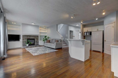 162 Prestwick Landing Se, Calgary, AB - Indoor With Fireplace