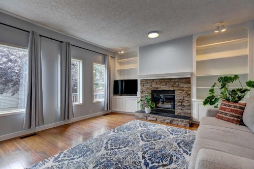 162 Prestwick Landing Se, Calgary, AB - Indoor Photo Showing Living Room With Fireplace
