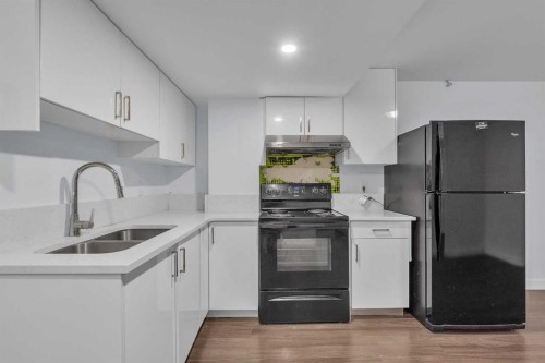 15 Kincora Crescent Nw, Calgary, AB - Indoor Photo Showing Kitchen With Double Sink