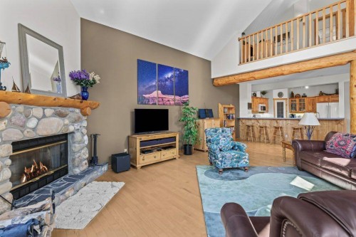18 Juniper Ridge, Canmore, AB - Indoor Photo Showing Living Room With Fireplace