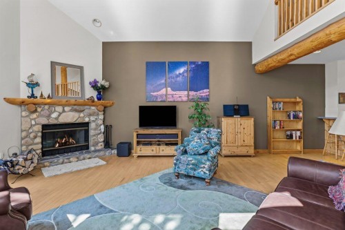 18 Juniper Ridge, Canmore, AB - Indoor Photo Showing Living Room With Fireplace