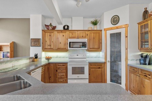 18 Juniper Ridge, Canmore, AB - Indoor Photo Showing Kitchen With Double Sink