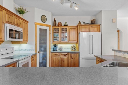 18 Juniper Ridge, Canmore, AB - Indoor Photo Showing Kitchen With Double Sink