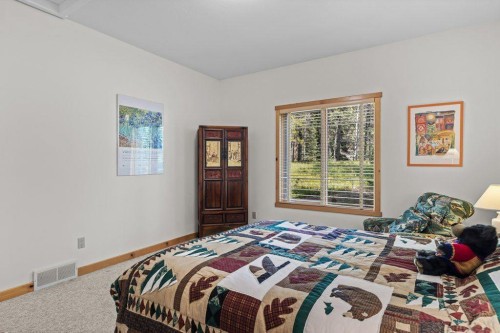 18 Juniper Ridge, Canmore, AB - Indoor Photo Showing Bedroom