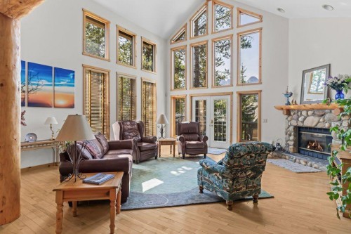 18 Juniper Ridge, Canmore, AB - Indoor Photo Showing Living Room With Fireplace